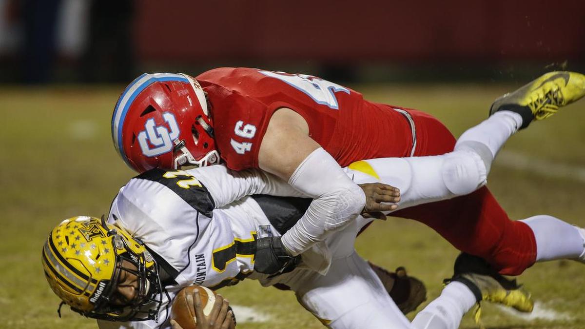 Charlotte Catholic defensive end Andrew Della-Mea sacks Kings Mountain quarterback Kaylon Wade on Friday.