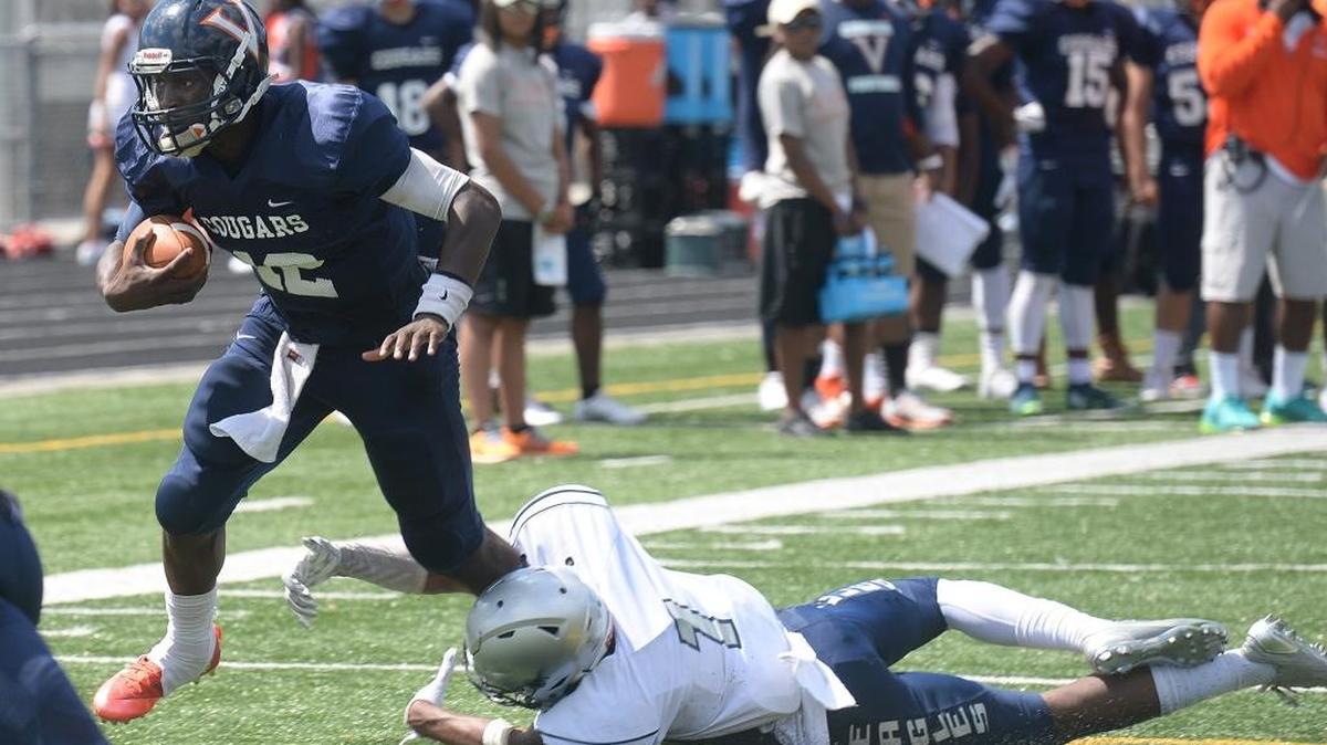 Vance quarterback Kingsley Ifedi scores one of his two rushing touchdowns against Danville George Washington (Va.) on Saturday in high school football at West Mecklenburg. Vance won 48-7.
