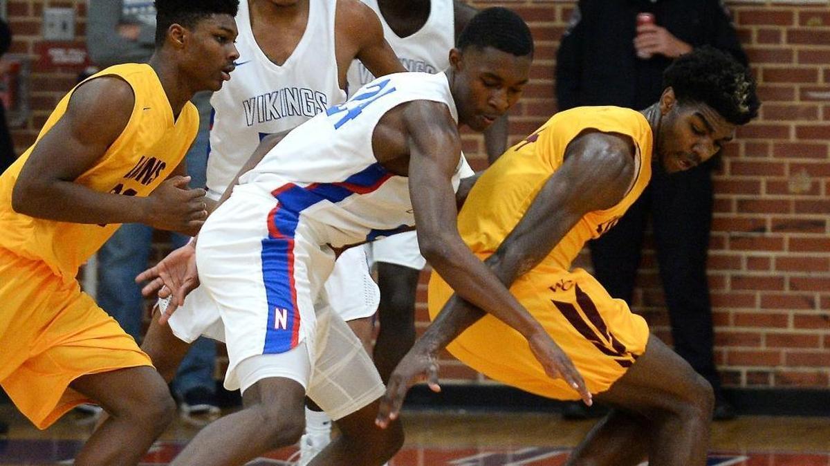 North Meck's Jae'Lyn Withers, left, strips the ball from West Charlotte's Patrick Williams, right, during first half action at North Meck High on Friday, December 8, 2017.