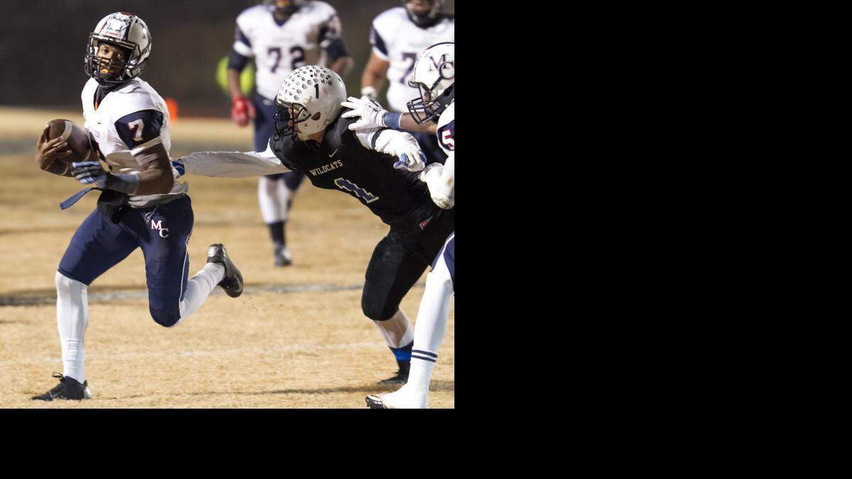 
Mallard Creek quarterback James Smith looks for running room against Lake Norman during the NC 4AA Western Regional Football Championship at Lake Norman High School in Mooresville, NC Friday, December 5, 2014. Photo by JASON E. MICZEK - Special to the Observer.

