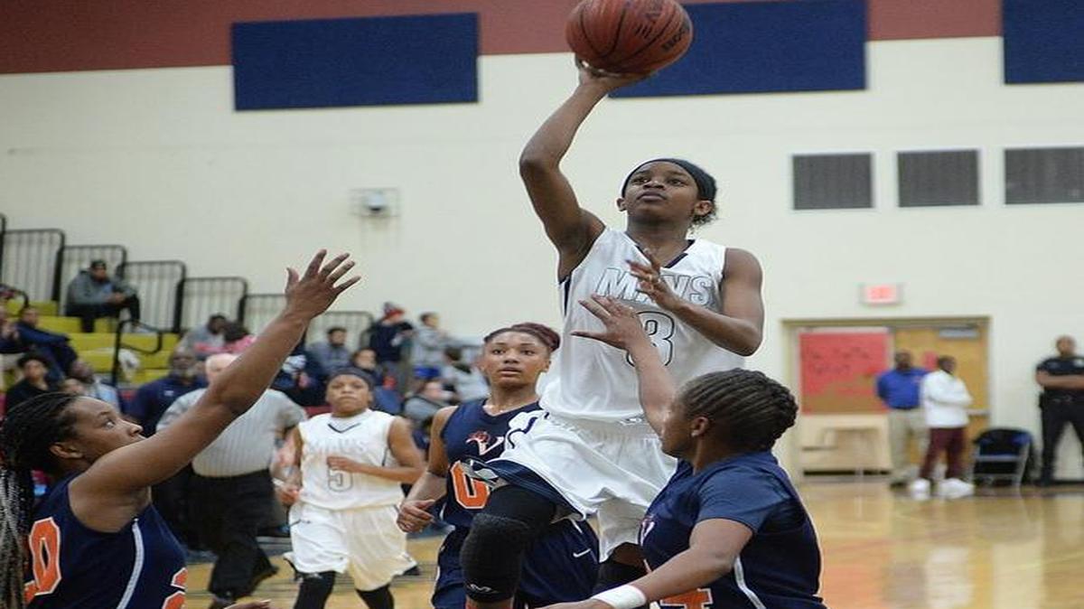Mallard Creek Mavericks girls varsity play Vance Cougars in Friday's prep basketball game at Mallard Creek high. Mallard Creek Mavericks #3 Janae Sanders drives a jumper to the basket over Vance Cougars players.