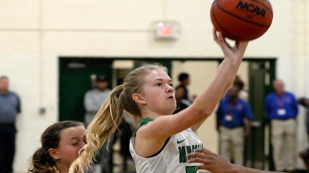 Myers Park's Chaselyn Dunn, center, releases a shot in the lane during second half action against East Meck in the Southwestern 4A tournament at Myers Park High School on Tuesday, February 14, 2017.