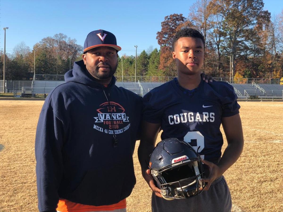 Vance High football coach Aaron Brand and QB Nigel Summerville