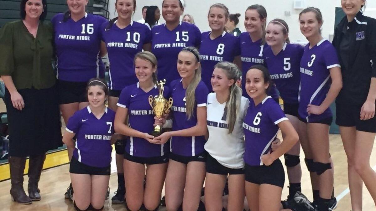 Porter Ridge’s volleyball team celebrates winning the Southwestern 4A championship Wednesday night