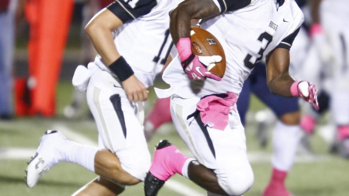 
Hough High quarterback Jackson Gibbs (11) runs with ball carrier Marquill Osborne (3) while facing Mallard Creek Oct. 9. Gibbs and Osborne helped the team beat AL Brown 21-7 to secure first place alone in the MECKA 8 conference. Photo by JASON E. MICZEK - Special to the Observer
