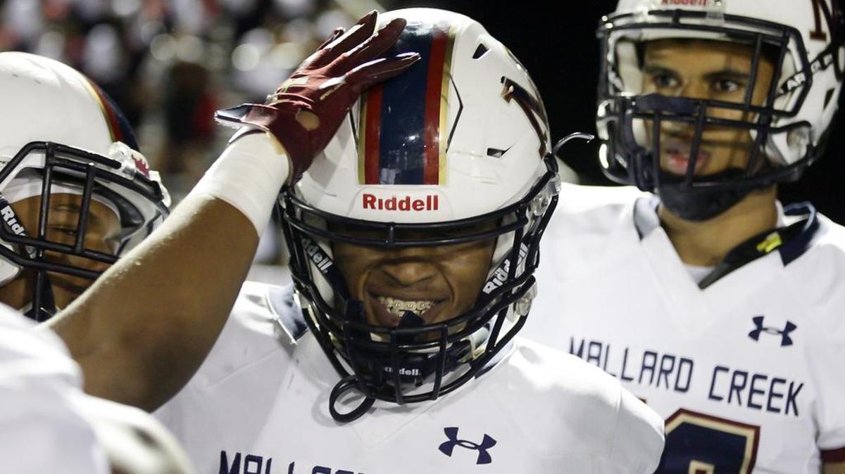 Mallard Creek running back Charles Mincey Jr. celebrates after scoring on an 80-yard touchdown run against Hough on Friday.