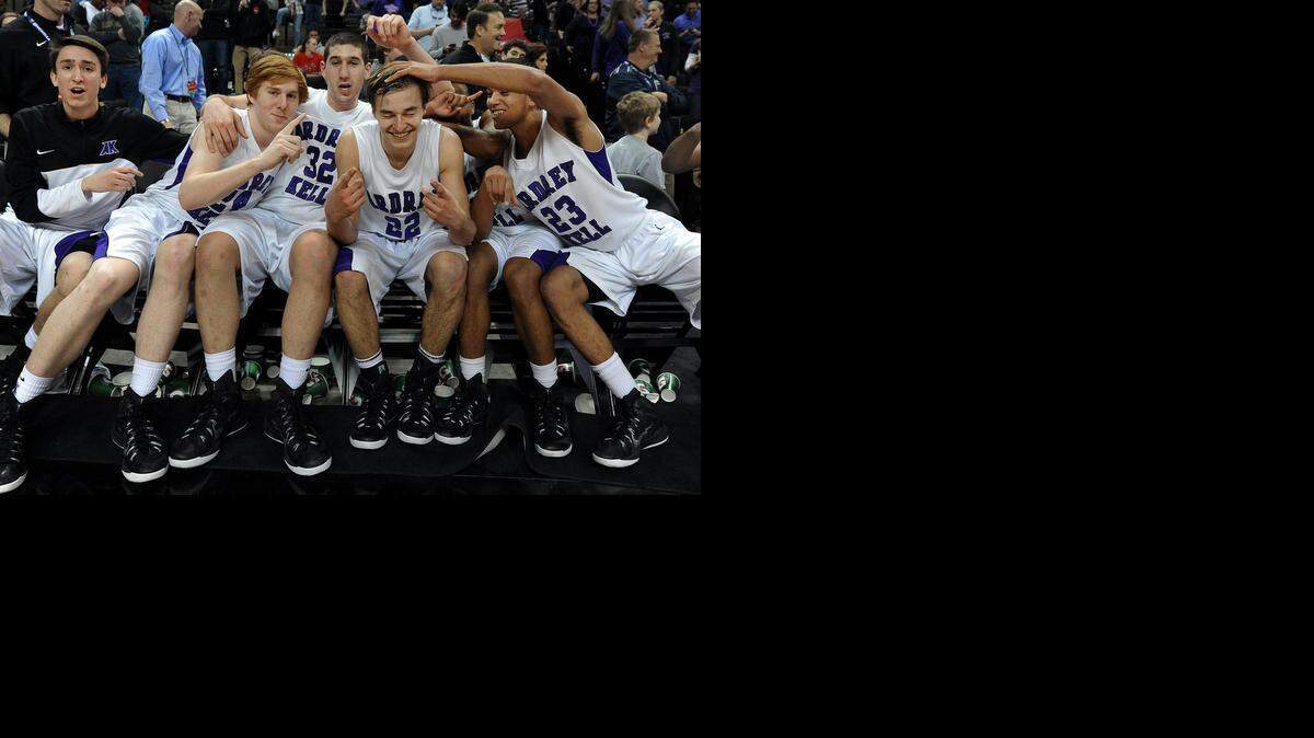 
Ardrey Kell's Steven Santa Ana is the center of attention with teammates (in white, from left) Michael Crosby (24), Josh Freund (32) and Rhyle Scott (23) following their victory over West Charlotte. 
