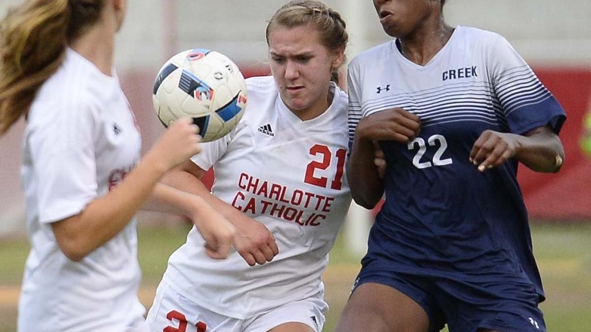 Charlotte Catholic's Alina Limpert on left, fights for control of the ball with Mallard Creek's Jada Palmer on right, during Tuesday night's third round playoff match played at Charlotte Catholic May 17, 2016. Charlotte Catholic defeated Mallard Creek 2-0.
