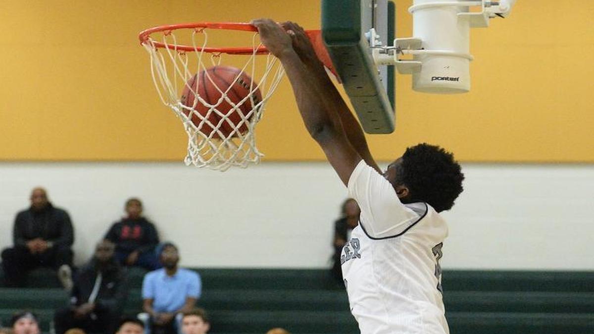Butler #2 Zane Rankin dunks to seal the win over Myers Park during Friday's boys Southwestern 4A championship game at Independence.