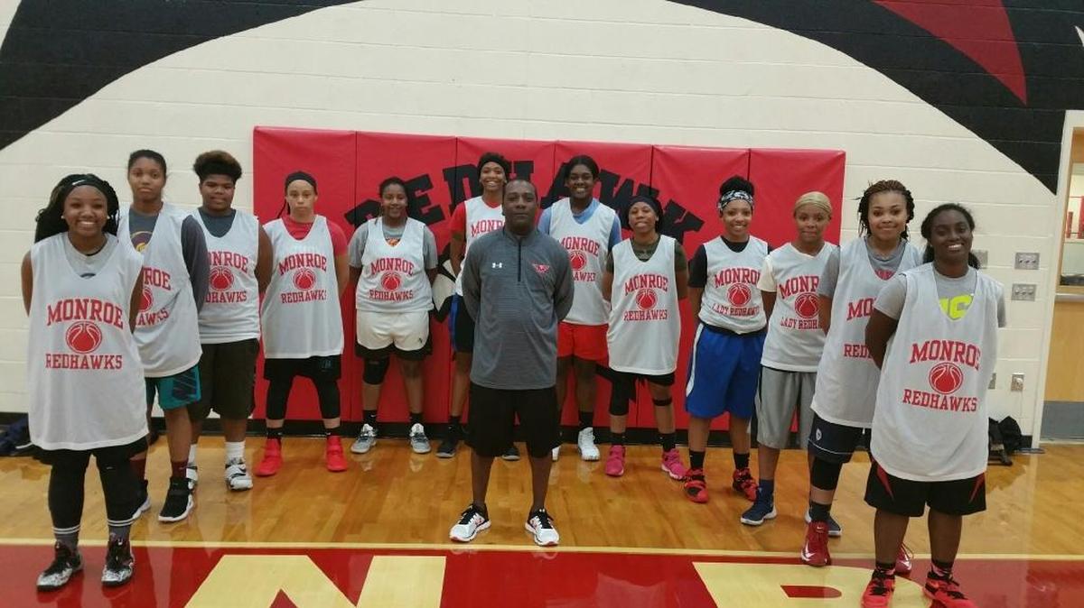 Monroe Girls Basketball team: From left, Destiny Wallace, Jehnyia Smith, Aunnia Rorie, Kyria Triplett, Essence Hamilton, Jasmine Reddick, Angel Roland, Ariel Knotts, Keena Parker, Jasmia Parsons, Quianna Parker, Tanaja Stevenson, with coach Leroy Osborne