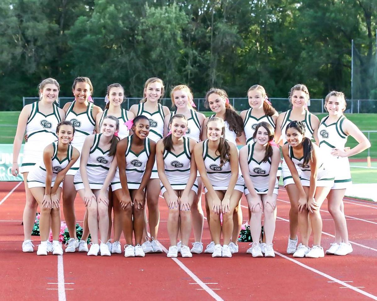 Charlotte Country Day’s cheerleaders pose during Friday’s game with rival Providence Day.