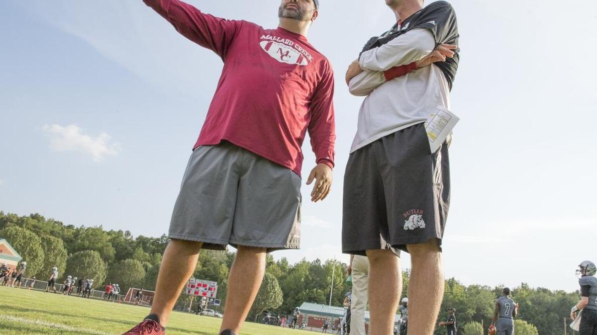 Mallard Creek head coach Mike Palmieri, left, and Butler coach Brian Hales will see their teams face off in a highly anticipated game Friday