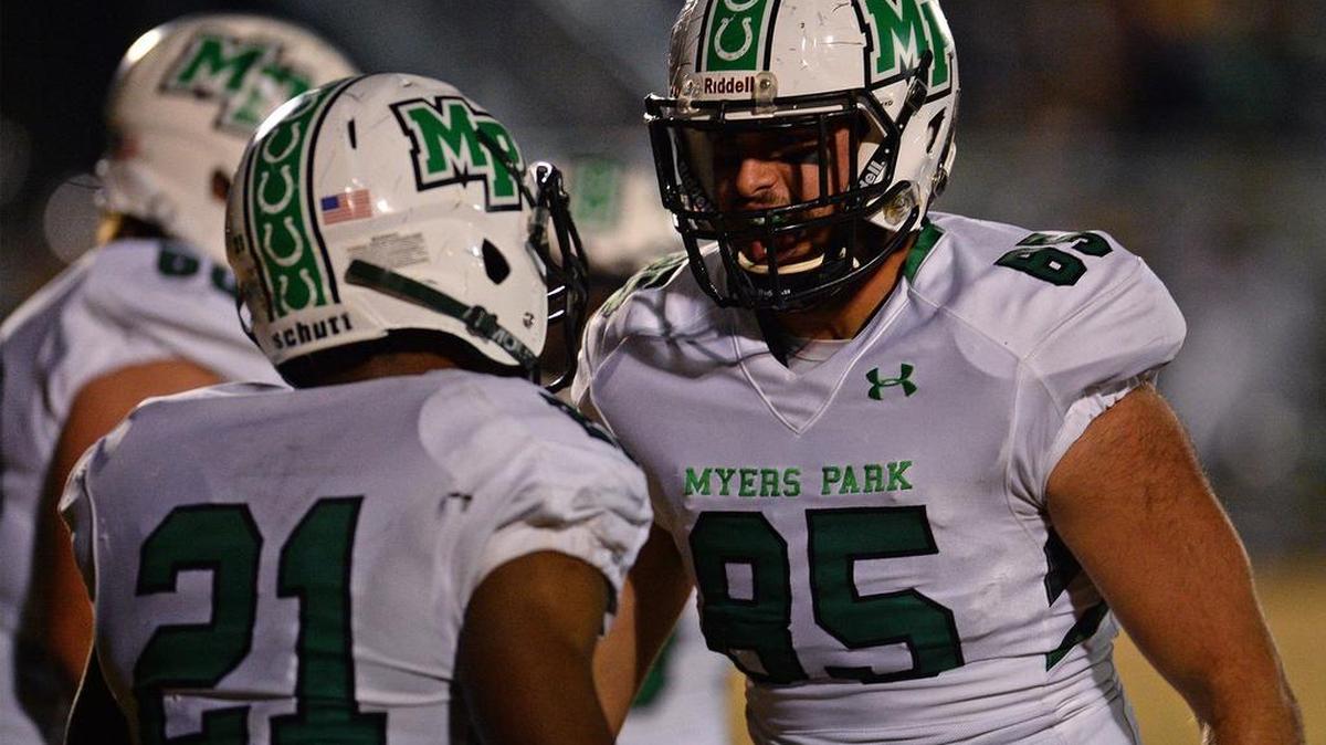 Myers Park tight end Garland Greenway, right, congratulates running back Khamal Howard, left, following Howard's rushing touchdown against Butler on Friday.