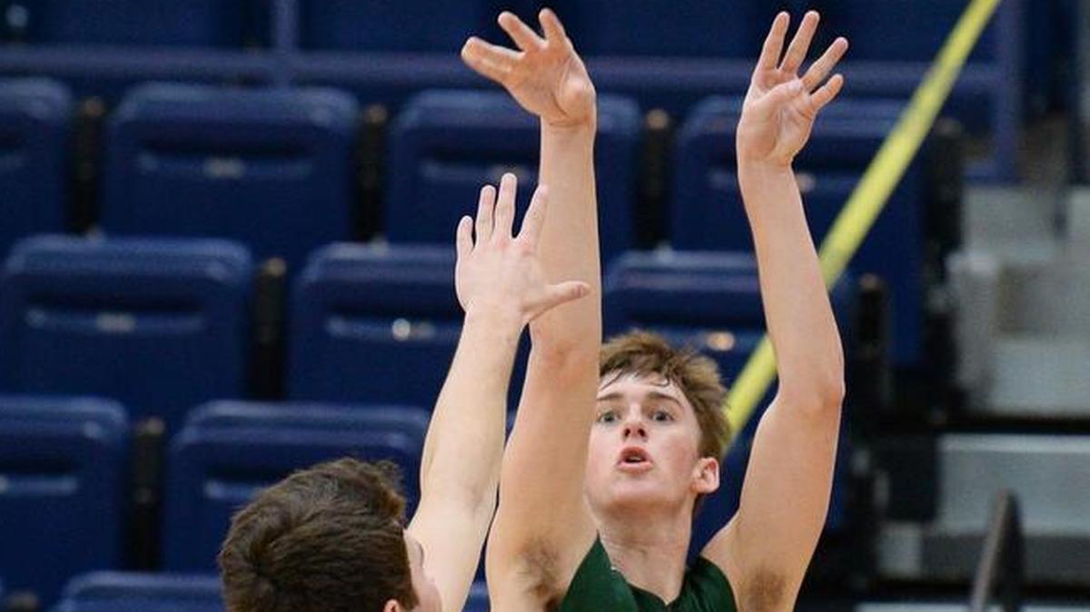 Charlotte Country Day School's Alex Tabor releases a shot over a Charlotte Latin defender during first half action on Monday, January 22, 2018 at Charlotte Latin School.