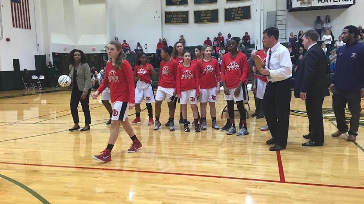 Davidson Day girls receive runner-up trophy after losing 43-34 to Carolina Day in the NCISAA 2A championship Saturday at Raleigh Ravenscroft.