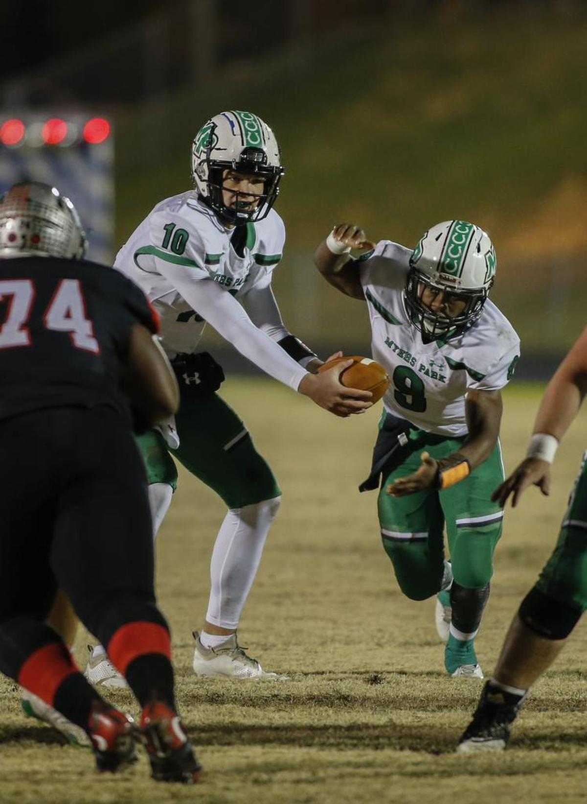Myers Park quarterback Drake Maye hands off to running back Jatoine Fields against Butler in the second round of the N.C. 4AA high school football playoffs in Matthews. Myers Park won 33-8.