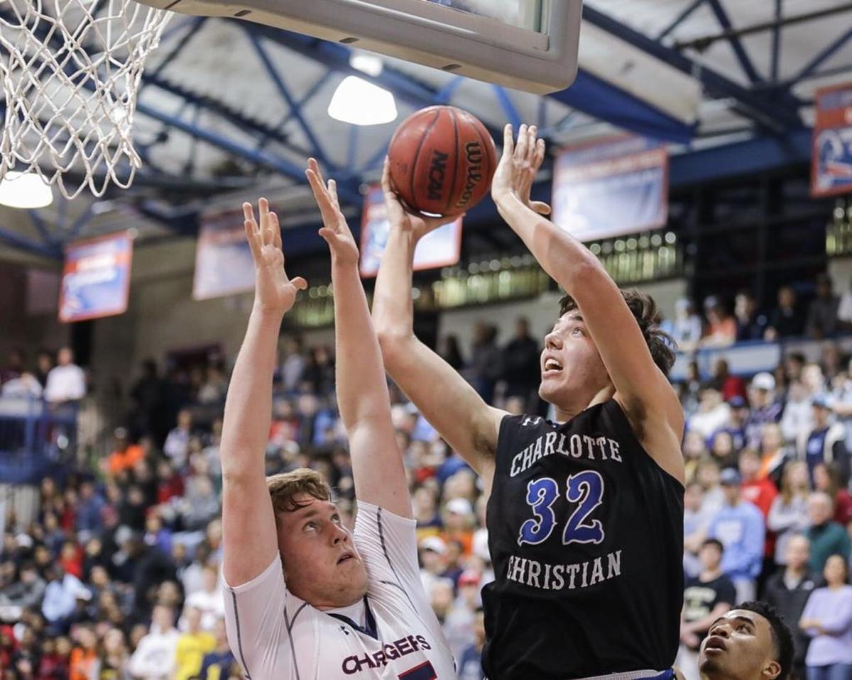 Charlotte Christian's Blake Preston (32) finishes the layup. Providence Day advanced to the NCISAA 3A semifinals by defeating Charlotte Christian on Friday.