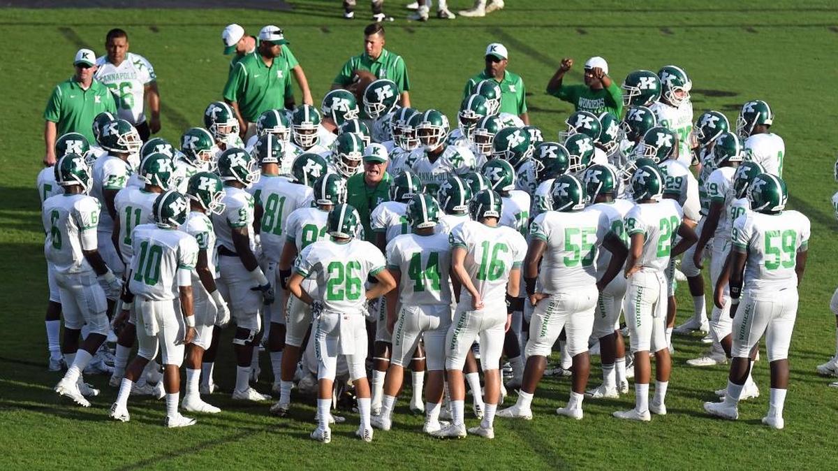 Kannapolis A.L. Brown High coach Mike Newsome (center) and his team will challenge for a league title this season.