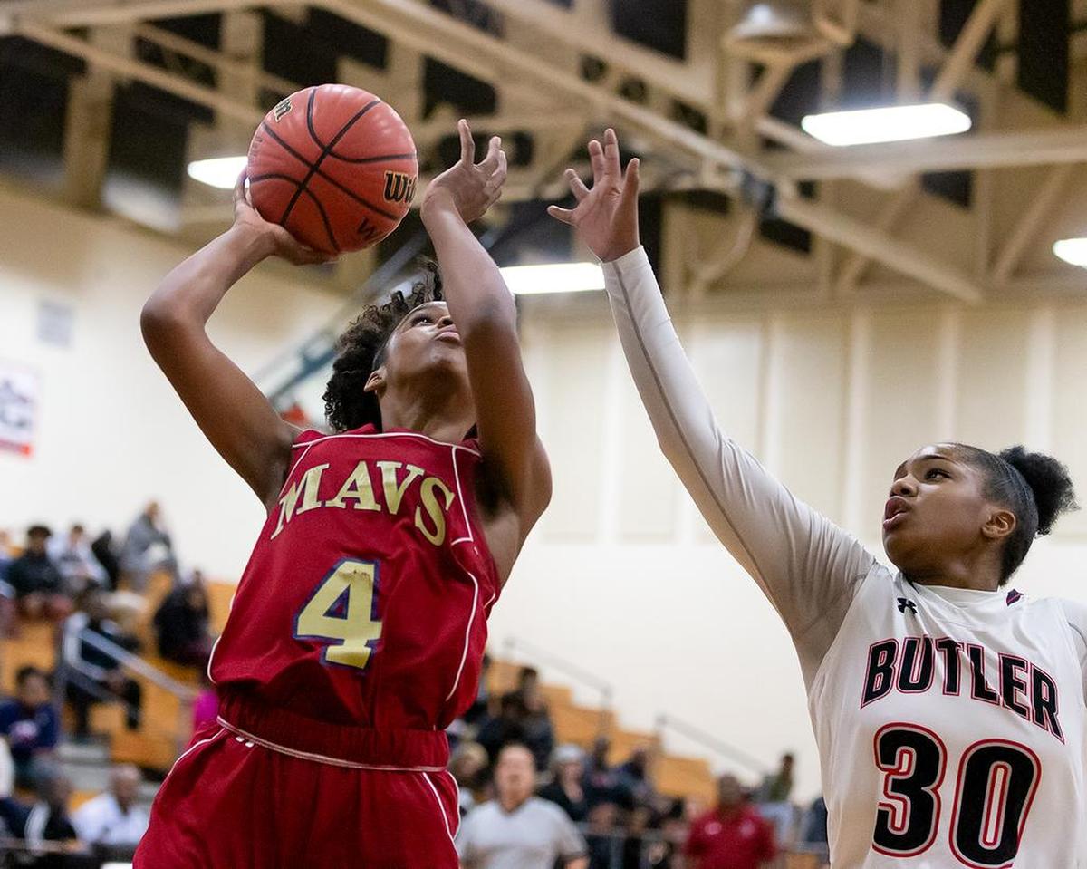 Mallard Creek’s Shonti Lutz (4) goes up strong against Butler’s Micahla Funderburk (3) in the teams’ game Thursday.