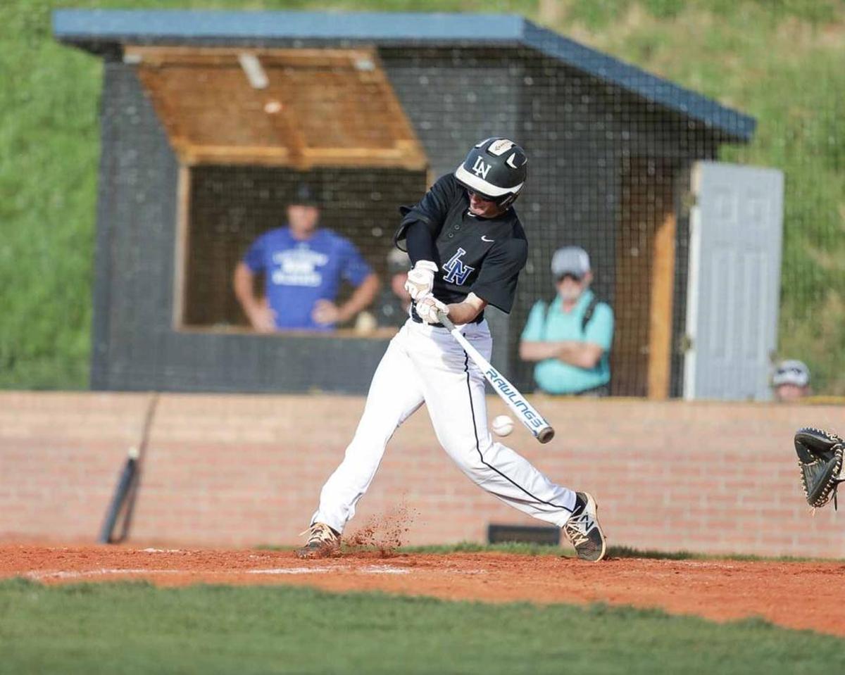 Lake Norman's Sam Zayicek (28) gets the base hit as the Wildcats tried to rally from behind in the 3rd inning. Hough would face the number 1 seed Lake Norman Wildcats in the 4A I-Meck Tournament Championship.