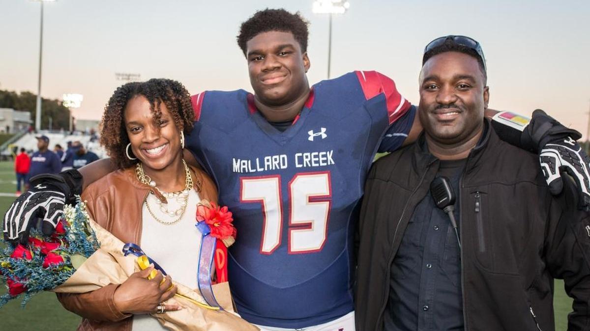 Mallard Creek defensive lineman Jordan Davis, seen with his parents on Senior Night, has committed to Georgia. He’ll lead the Mavericks into Saturday’s N.C. 4AA state final against Wake Forest.