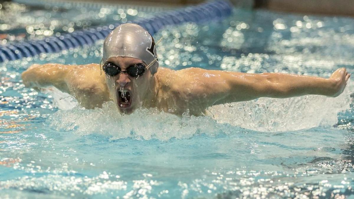 Ryan Alicandri of Hough High makes the turn and heads to the blocks in his 100 yard butterfly heat the 4A West Regional Championships