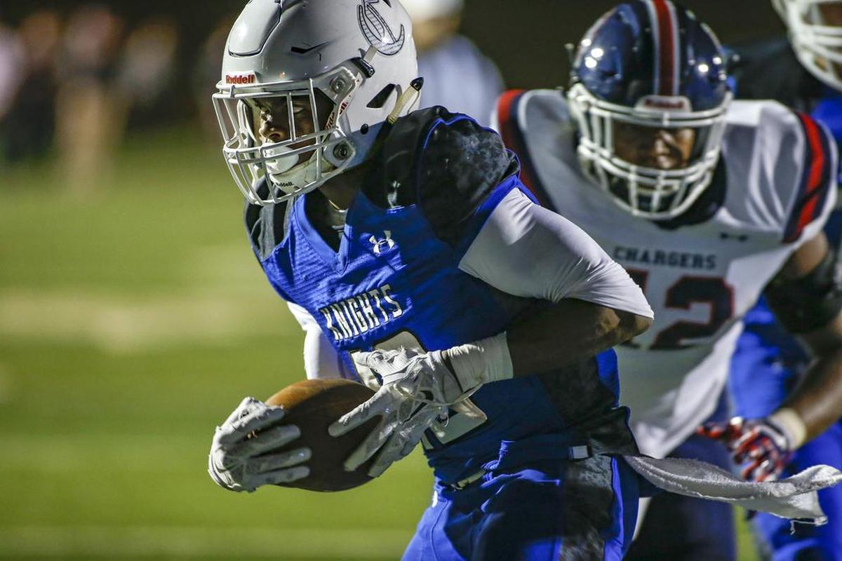 Charlotte Christian running back Ben Williams scores a rushing touchdown against Providence Day in the second quarter of Friday’s football game.