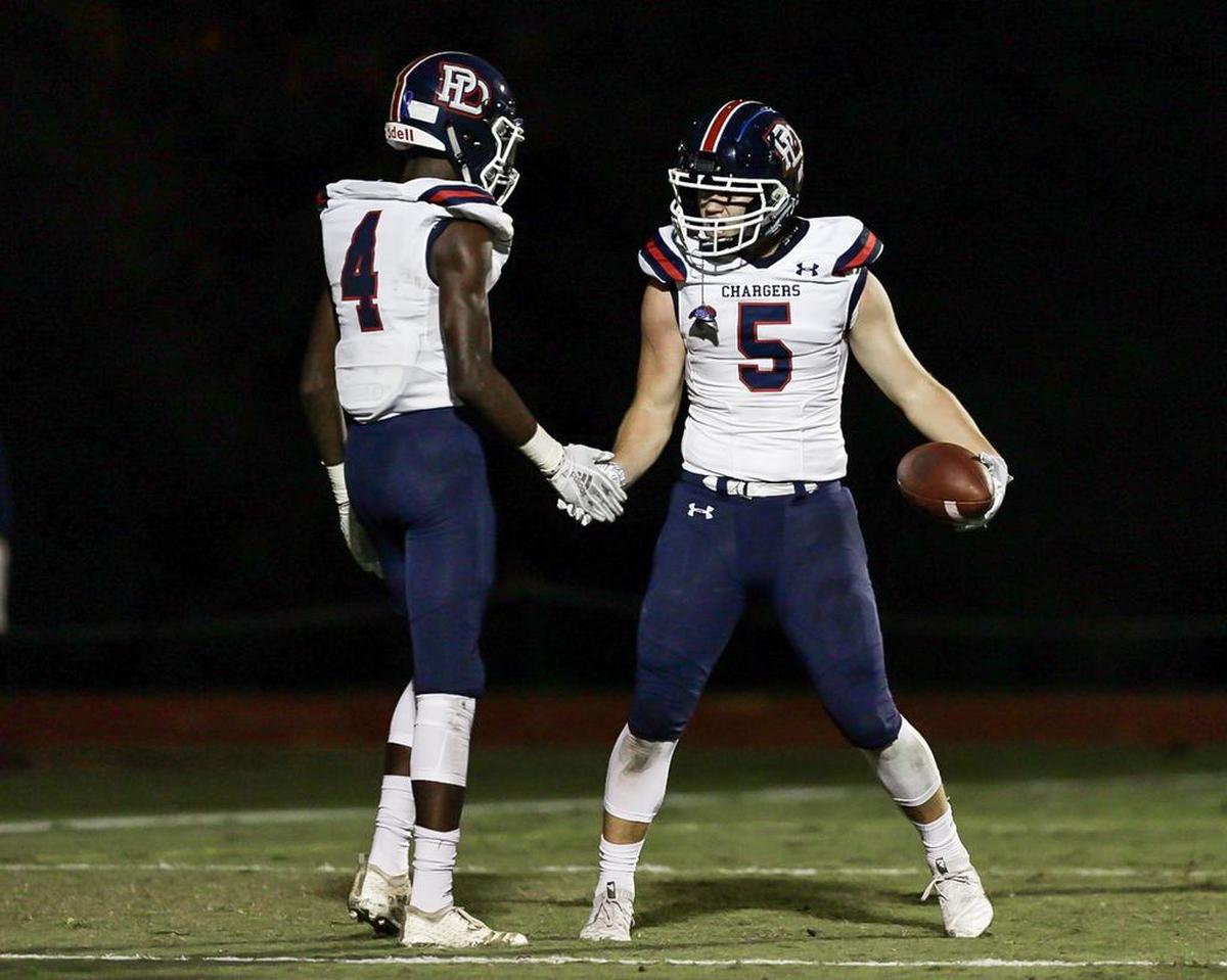 Providence Days’ Parker McRae (5) celebrates a touchdown pass in the second quarter of Friday’s 42-6 win over Charlotte Country Day.
