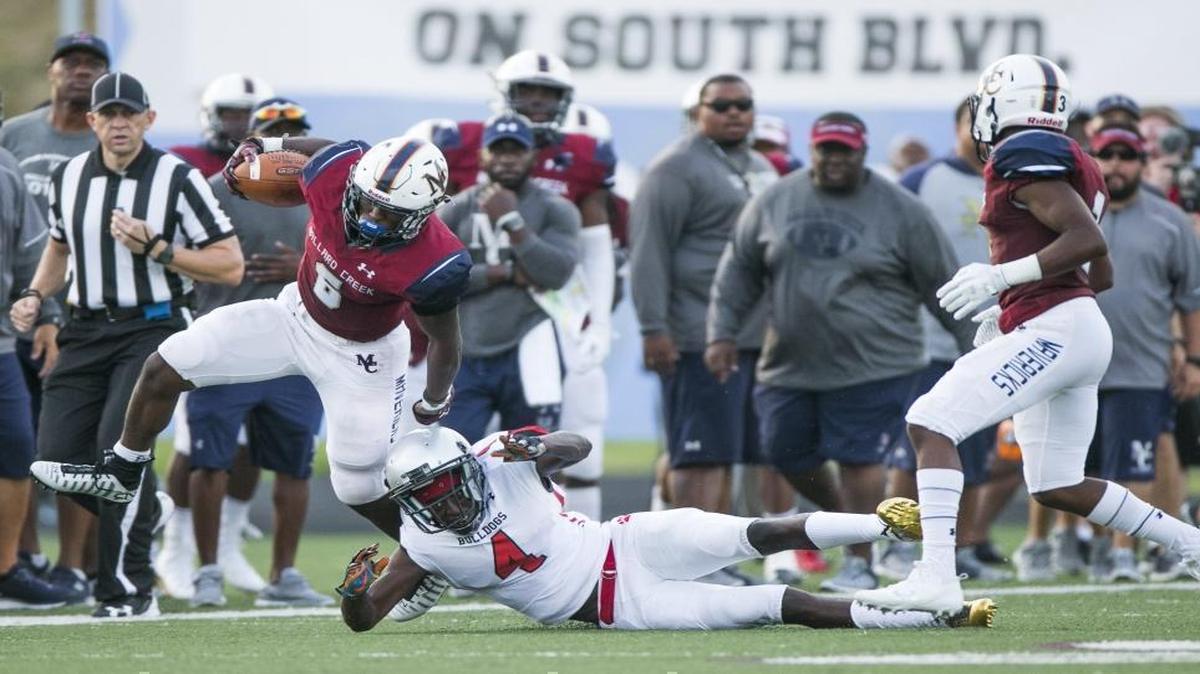 Mallard Creek running back Nasjzae Bryant (6) tries to get past a Butler defender during a varsity football game at Mallard Creek High School Friday, August 25, 2017 in Charlotte, NC. Photo by JASON E. MICZEK - Special to the Observer