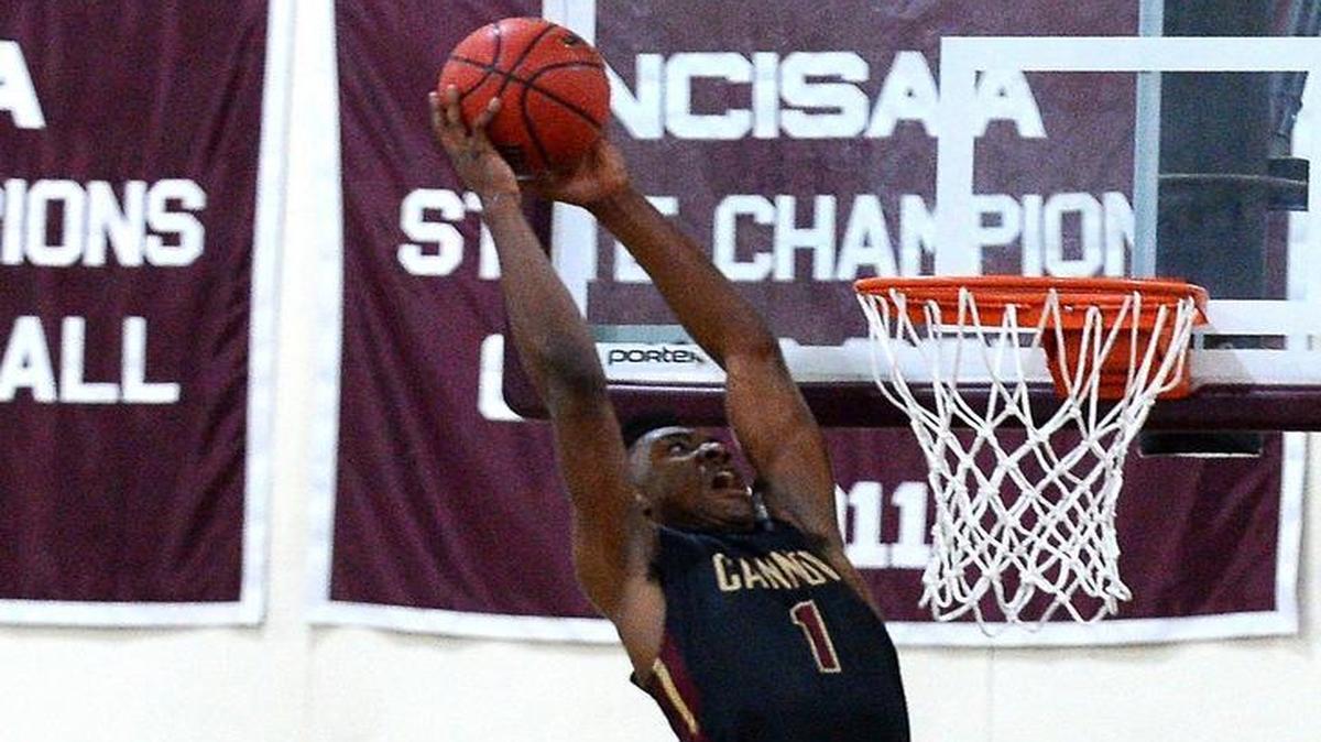 Cannon School's Jairus Hamilton hangs suspended in the air as he prepares to throw down a two-handed dunk against Charlotte Christian on Tuesday, January 17, 2016 at Cannon School in Concord, NC. Charlotte Christian defeated Cannon School in double overtime 76-71.