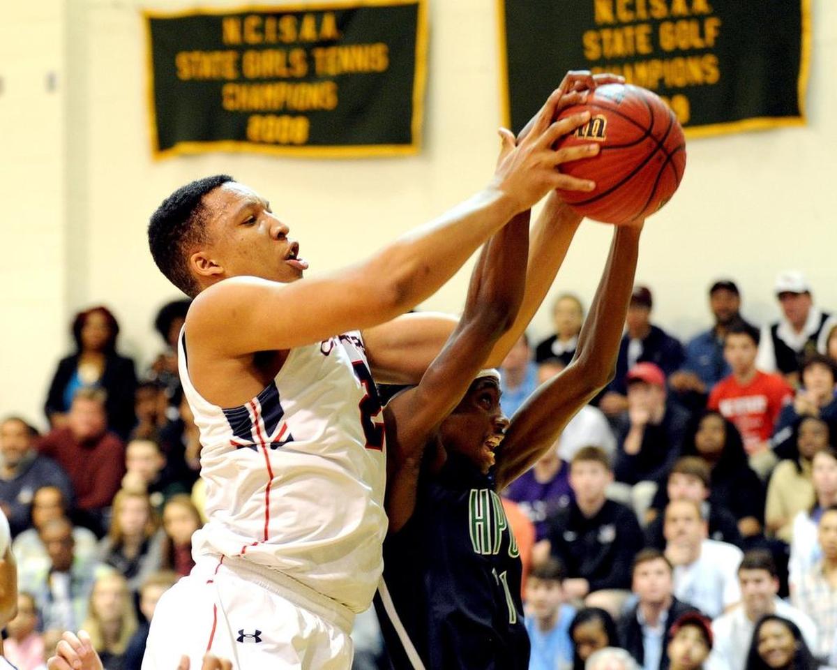 Grant Williams, left, battles High Point Christian’s Michael Hueitt for a rebound during Providence Day’s state title victory in Raleigh.