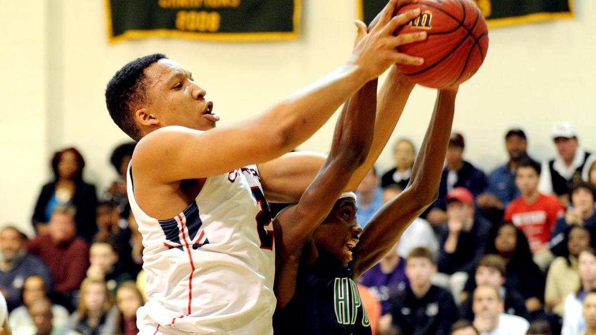 Grant Williams, left, battles High Point Christian’s Michael Hueitt for a rebound during Providence Day’s state title victory in Raleigh.