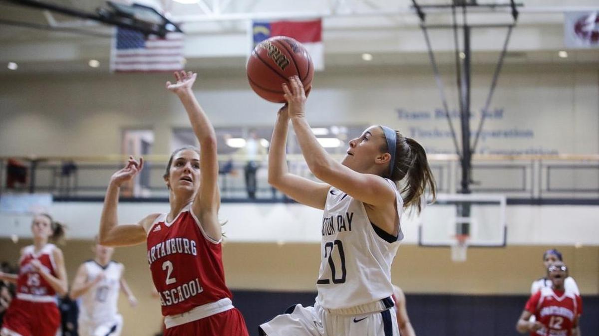 Gaston Day's M. Boston (right) shoots a running baseline shot during early first half action. Tuesday December 12, 2017ii