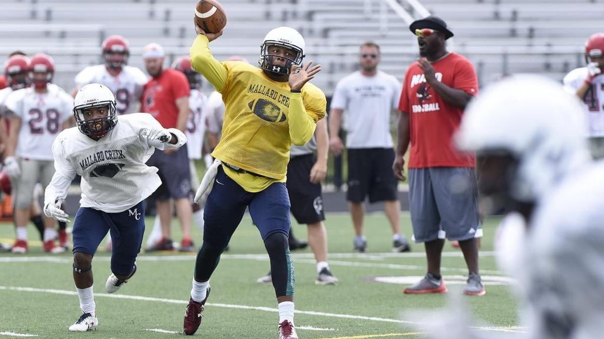 Mallard Creek quarterback Chauncey Caldwell passes against Fort Mill’s Nation Ford during Wednesday’s scrimmage at Mallard Creek. Caldwell played last season for Durham Hillside.