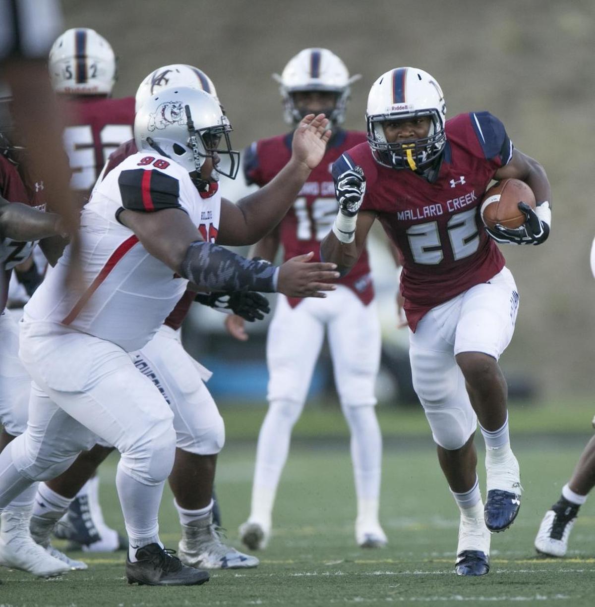 Mallard Creek’s Trenton Simpson looks for room around the Butler defense in Friday’s game. Simpson carried 14 times for 150 yards as the Mavericks, ranked No. 2 in the Observer Sweet 16, improved to 2-0.