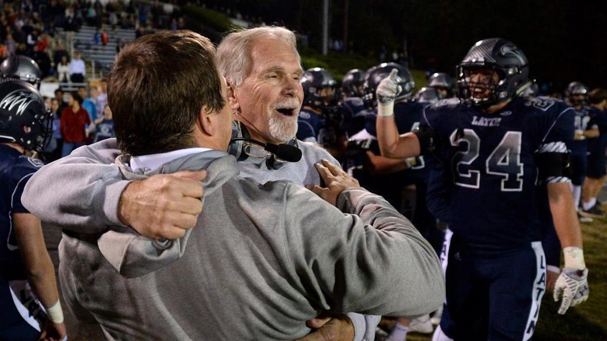 Charlotte Latin head coach Larry McNulty, facing camera, won his 13th N.C. Independent Schools state championship with a dominant 33-0 win over Charlotte Country Day