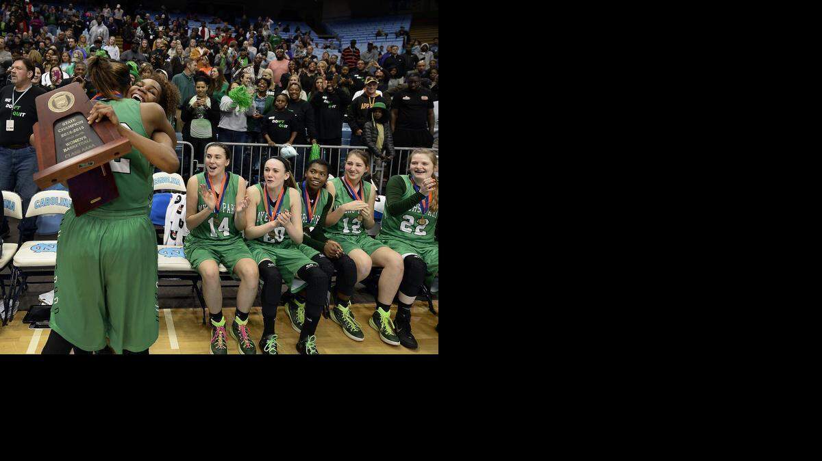 
Myers Park's Rydeiah Rogers (32) and Aliyah Mazyck (23) embrace following the team's victory over Southeast Raleigh in the NCHSAA 4A championship game Saturday. Tuesday, the school will appeal an NCHSAA rule that doesn’t allow the Mustangs to play in a national tournament.
