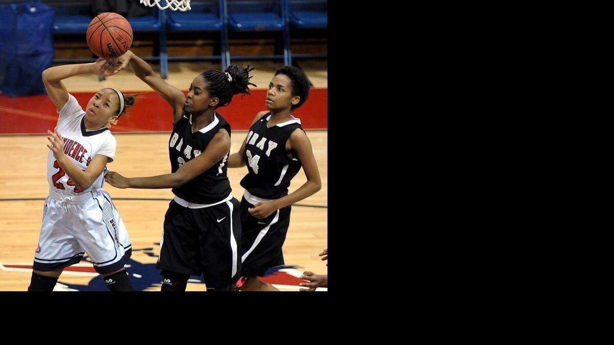 
Providence Day’s Kennedy Boyd (24), fouled by Gray Collegiate’s Taylor Toney (2) in a January game, led her team to a NCISAA state title Saturday. The freshman point guard had a team-high 13 points and seven rebounds, plus some crucial fourth quarter free throws, in a 36-29 win over Rabun Gap (GA) in the N.C. Independent Schools state 3A final.
