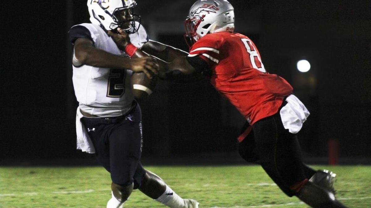 South Pointe’s Elijah Adams (8) pressures Mallard Creek quarterback Chauncey Caldwell during the second quarter Friday night.