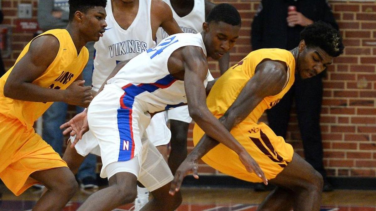 North Meck's Jae'Lyn Withers, left, strips the ball from West Charlotte's Patrick Williams, right, during North Meck’s win on Friday, December 8, 2017. The teams meet again Tuesday