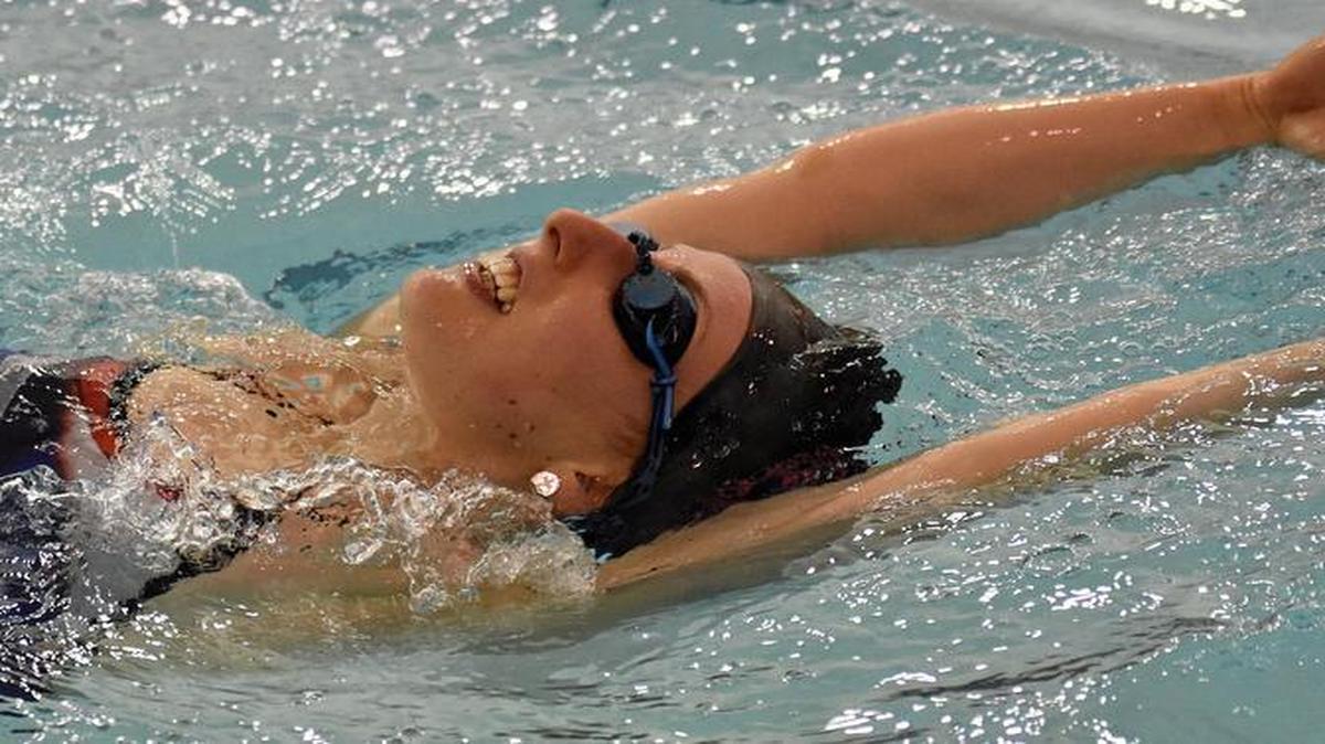 Emma Stump, an 18-year-old senior at Charlotte Catholic, works on her routine during a training session with Carolina Synchro coach Anne Schulte at the Huntersville Family Fitness and Aquatic Center. Stump qualified in the Junior Solo division for the U.S. National Synchronized Swimming Championships, scheduled for April 6-9 in Mesa, Ariz.
