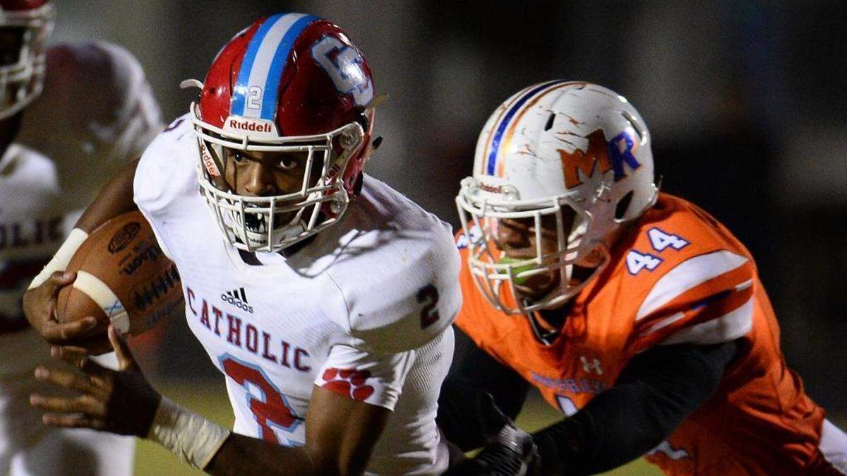 Charlotte Catholic running back Milan Howard (left, file photo) was named game MVP with 160 yards rushing and 20 receiving in Saturday’s NCHSAA 3A state championship.