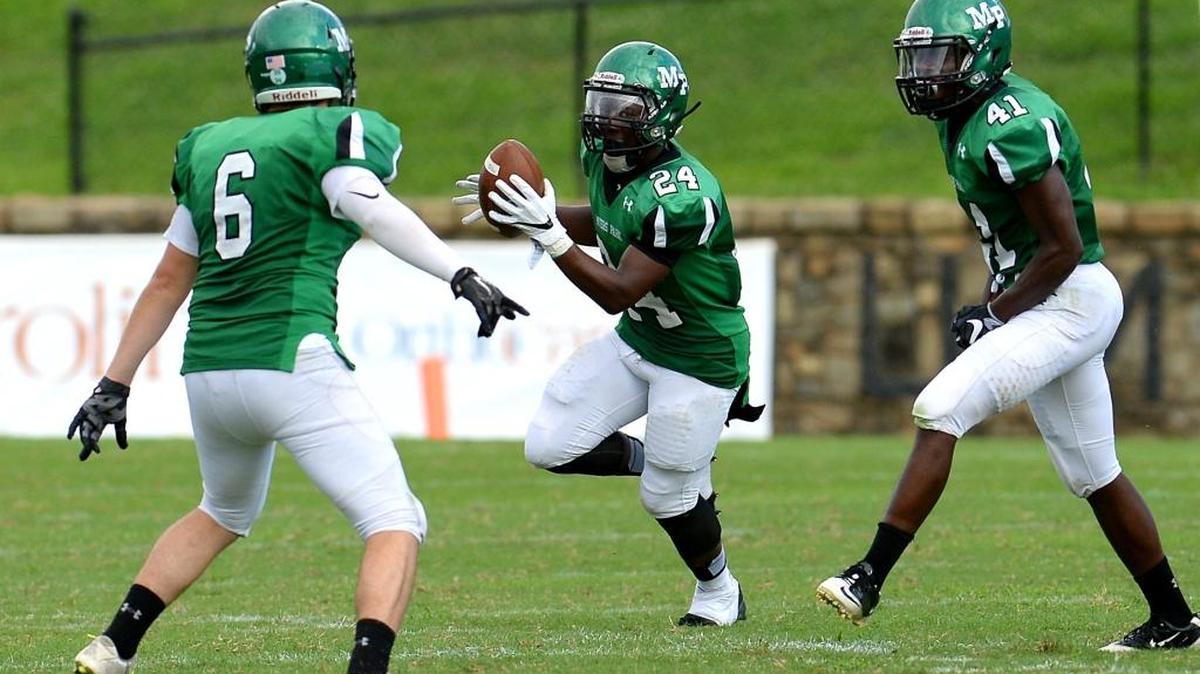 Myers Park's Kevin Alford, center, and his teammates are 6-0 after Friday’s win over Rocky River