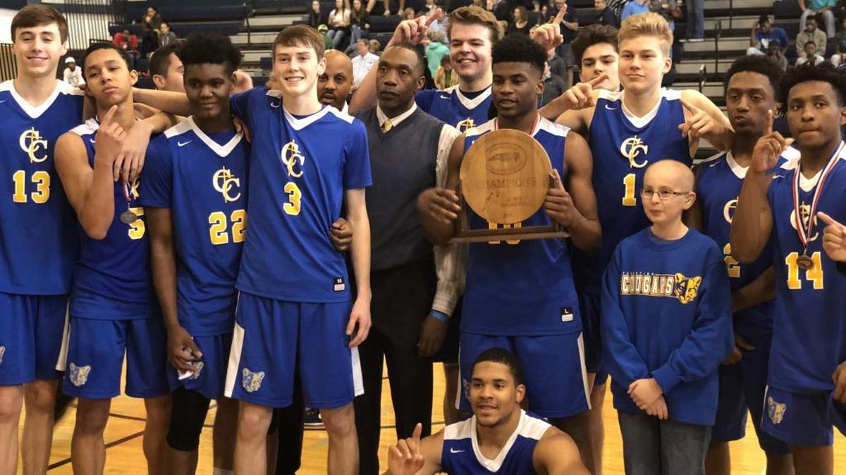 Carmel Christian and head coach Byron Dinkins celebrate winning the NCISAA 2A state championship game Saturday