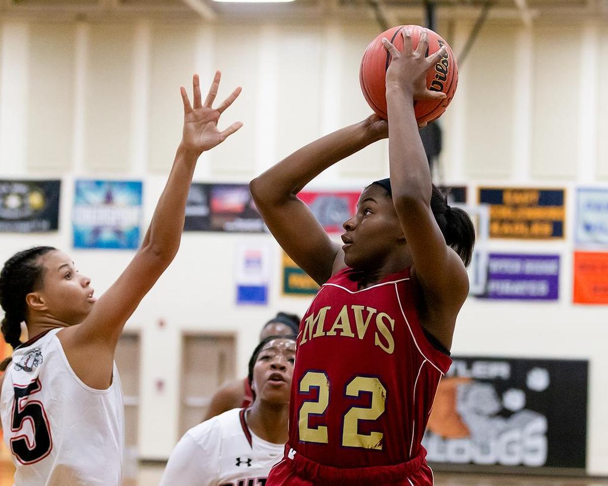 Mallard Creek’s Sydney Hunter (22) pulls up for the jumper against Butler.