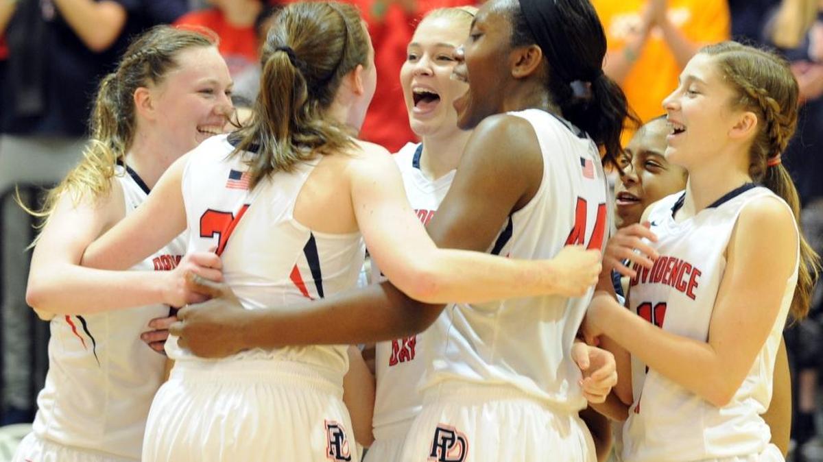 Providence Day celebrates its victory against Ravenscroft in the NCISAA 3A girls basketball championship game in Raleigh on Saturday. Providence Day won 42-21.