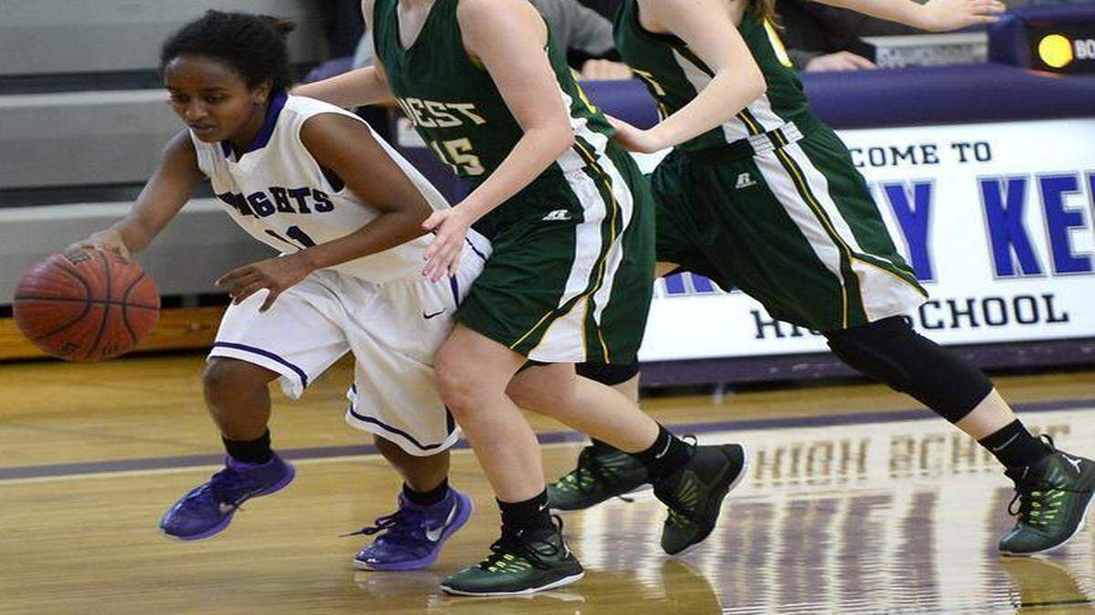 
The West Forsyth defense chases after Ardrey Kell's Journey Muhammad (11) during first round NCHSAA playoff action on Saturday February 28, 2015 at Ardrey Kell High School in Charlotte, NC. Ardrey Kell defeated West Forsyth 63-45
