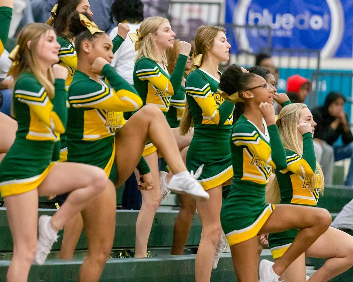 Independence’s cheerleaders cheer their team on at home Tuesday against Olympic