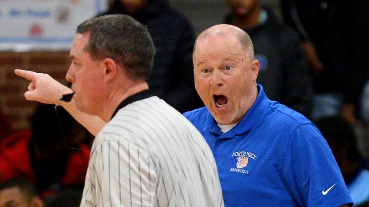 North Meck head coach Duane Lewis yells at an official during first half action against West Charlotte on Friday, December 8, 2017 at North Meck High .