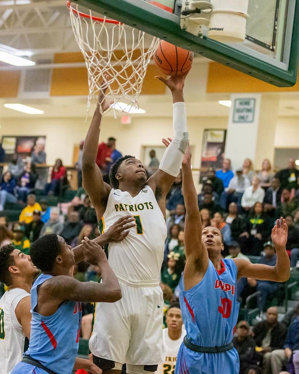 Independence's Matt Smith (1) wins the rebound and puts it back in for the 2-point basket.
